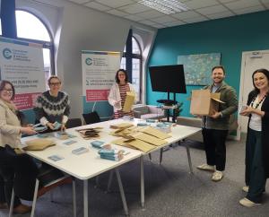 Photo of the team from COSICA preparing for their awareness raising initiative on supports and services